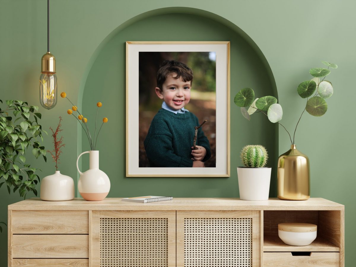 Mockup photo frame green wall mounted on the wooden cabinet.3d rendering